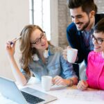 coworking-colleagues-having-conversation-at-workplace-1.jpg